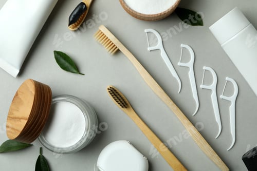 Preview: Oral care accessories on gray background, top view