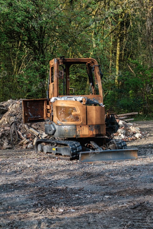 Preview: Burnt out construction digger by thieves.