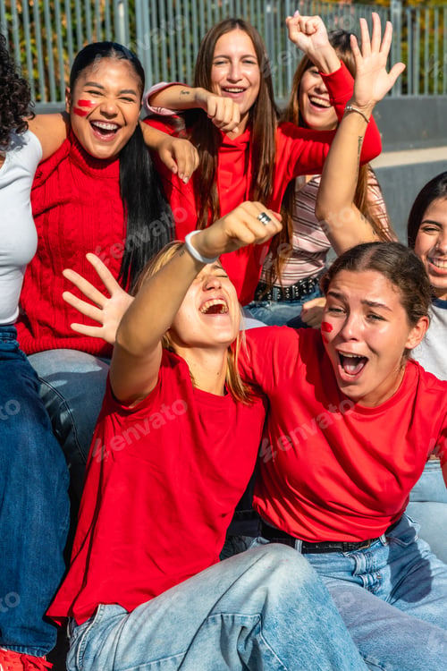 Preview: Group of diverse women friends cheering celebrating team victory