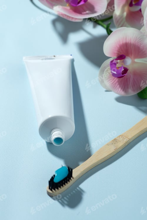Preview: Toothpaste tube with toothbrush on background