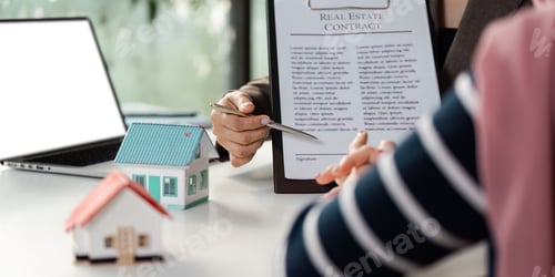 Preview: Real estate agent explaining contract details to client, in office environment.