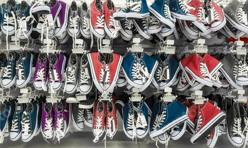 Preview: Many pair of sneakers in a store.