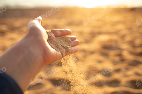 Preview: Sand flowing through the hands.