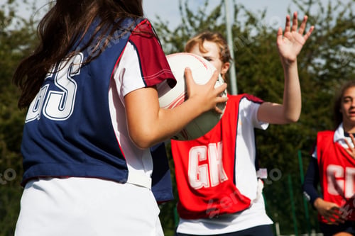 Preview: Teenage schoolgirl netball players defending