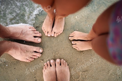 Preview: Family bonding at the beach with toes in the soft sand