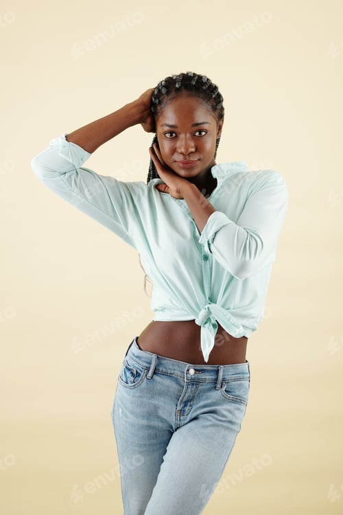 Preview: Woman posing against yellow background