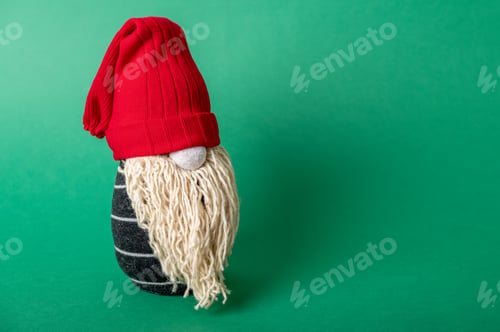 Preview: Handmade Christmas gnome on green background