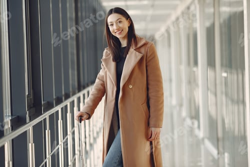 Preview: Woman with suitcase at the airport