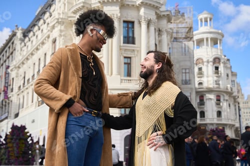 Preview: Happy gay couple smiling and sharing a moment of love in the city