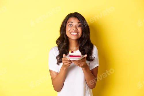 Preview: Portrait of beautiful african-american girl celebrating birthday, smiling and looking happy and