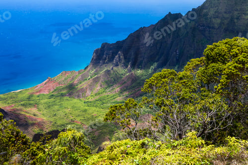 Preview: Dramatic landscape and steep ridge, cliffs looming above a valley and view to the sea.