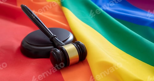 Preview: LGBT Law, Gay marriage. Judge gavel on rainbow color textile, close up. Transgender rights