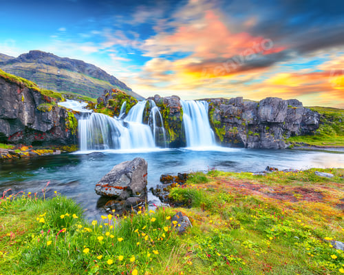 Preview: Fantastic view on Kirkjufellsfoss waterfall near Kirkjufell mountain at sunset