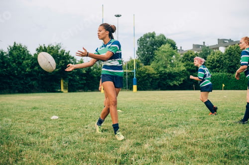 Preview: Female rugby player passing the ball during a training session