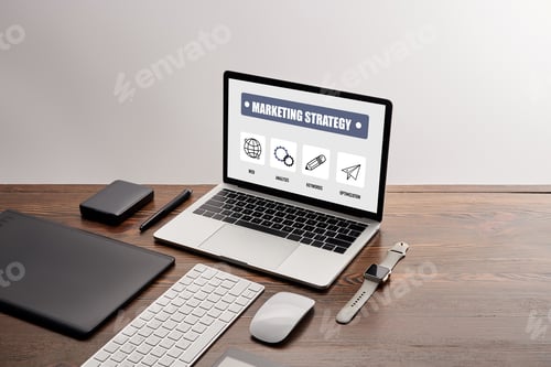 Preview: flat lay of gadgets and laptop with marketing strategy website on screen at workplace isolated on