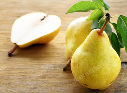 Preview: ripe organic pears on a wooden table