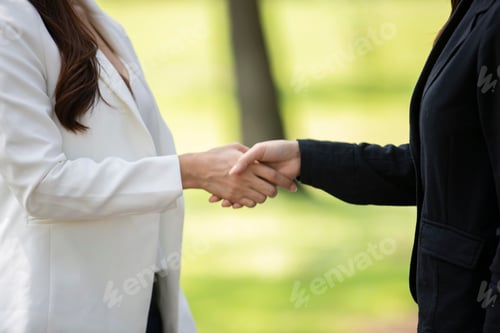 Preview: business team touching hands together after complete a deal in meeting.
