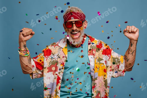 Preview: Happy senior man in funky shirt and bandana gesturing