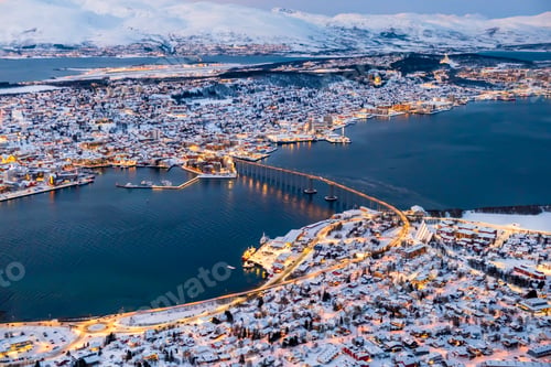 Preview: Aerial view of Tromso, Norway with city lights in winter from Storsteinen mountain.