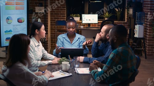 Preview: Diverse coworkers brainstorming, listening to executive in business meeting