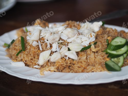 Preview: Crab Fried Rice with Cucumber Slices on Plate