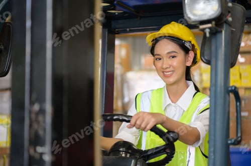 Preview: Female worker driving a forklift moving goods in the warehouse Practicing forklift operation