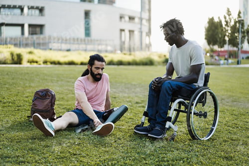 Preview: Happy friends with disability having fun at park city - Focus on african man hands
