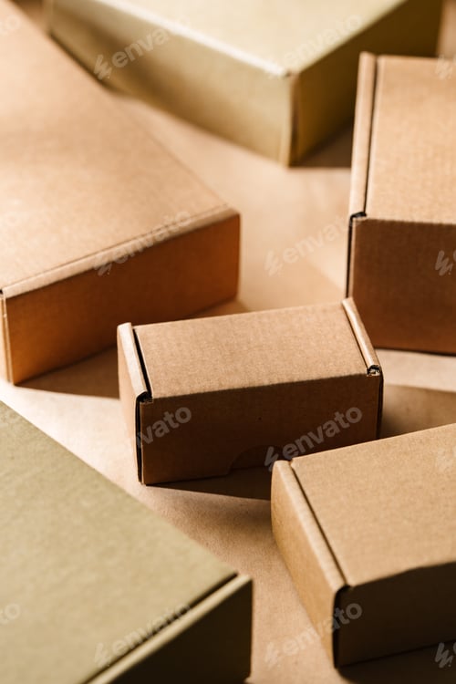 Preview: Multiple cardboard boxes arranged on a surface for packaging and shipping in a warehouse setting