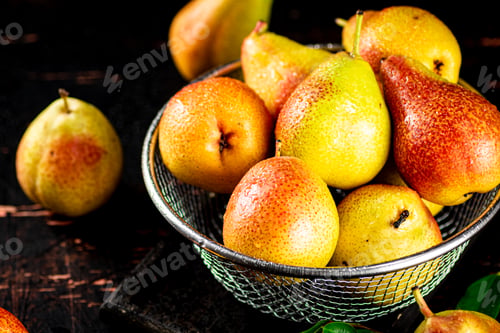 Preview: Ripe pears in a colander.