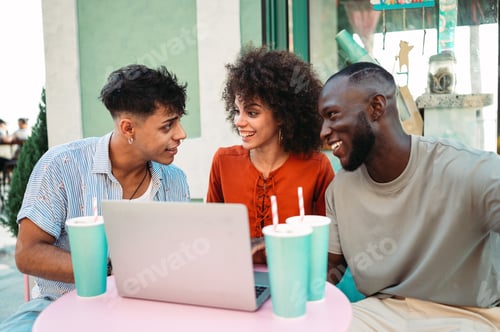 Preview: Multicultural startup team enjoys a relaxed outdoor meeting, collaborating over a laptop, having fun