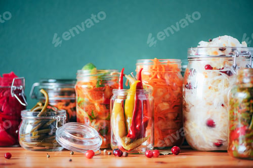 Preview: Probiotics food background. Korean carrot, kimchi, beetroot, sauerkraut, pickled cucumbers in glass