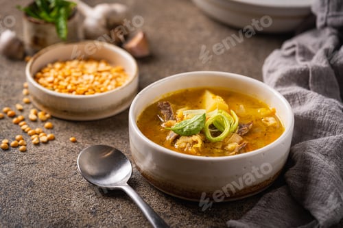 Preview: Closeup of a bowl of split pea soup with chunks of ham and meat