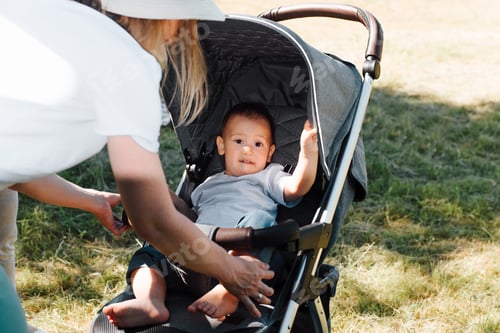 Preview: Mother with Baby in Stroller Outdoors
