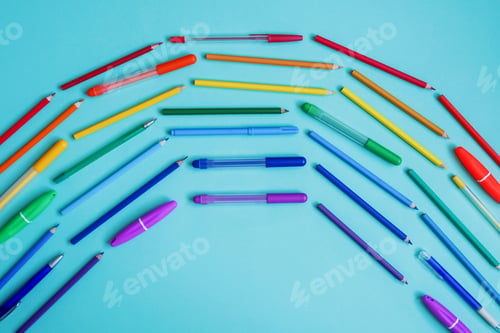 Preview: Rainbow from stationery on blue background.