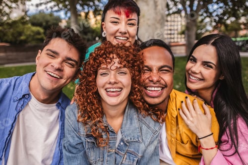 Preview: Group of happy multiethnic friends having fun together outdoors