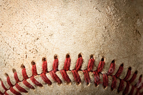 Preview: Close-up of a Weathered Baseball with Red Stitching