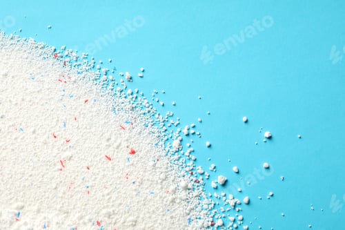 Preview: Washing powder on blue background, space for text