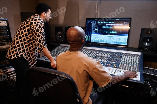 Preview: Two Men Working On Audio Track