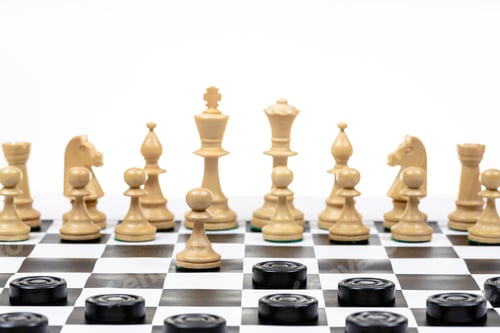 Preview: Chess and Checkers Game Pieces on a Board
