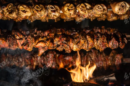 Preview: Beautiful view of meat BBQ on rotisserie with fire