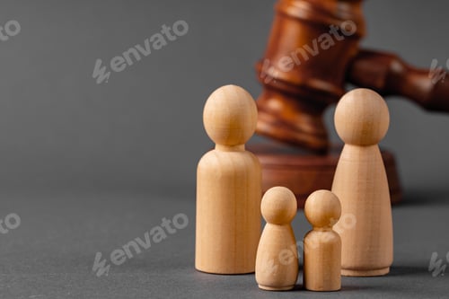 Preview: Wooden toy family and judge mallet. Family divorce concept