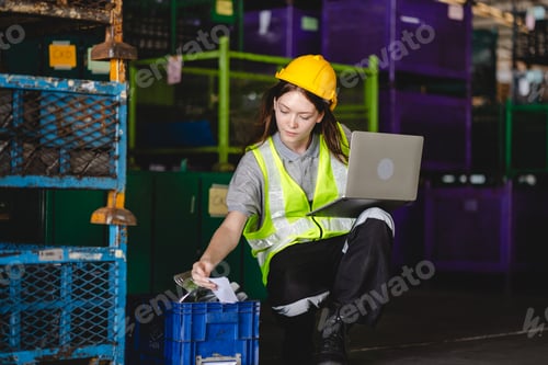 Preview: paper cardboard manufacture factory concept, industry worker person working with recycling machine