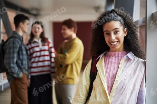 Preview: Portrait of Young Polyethnic Woman Smiling in University Hallway