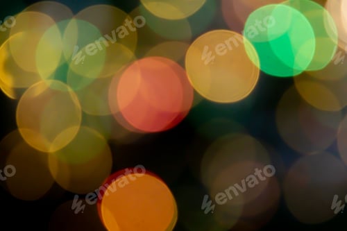 Preview: Dark background with a vibrant display of multicolored bokeh lights.
