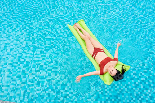 Preview: Woman Relaxing on Inflatable Mattress