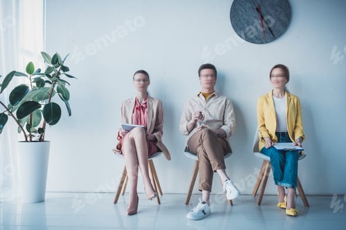 Preview: motion blur of employee holding bottle with water and women sitting on chair