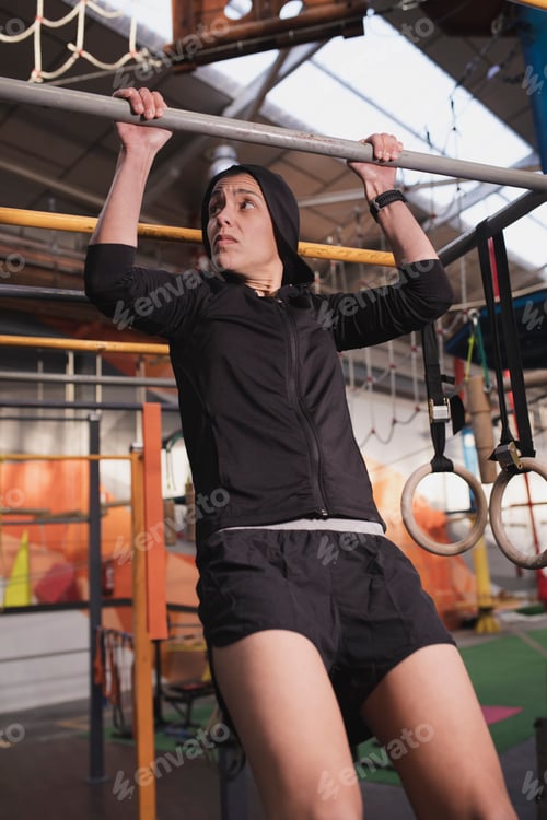 Preview: Athletic woman training in gym
