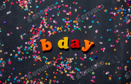 Preview: Birthday letters and confetti around on a table