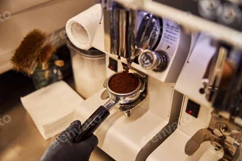 Preview: Fresh-ground coffee falling into the portafilter in cafe