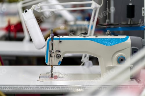 Preview: a close up macro photo of a needle of sewing machine